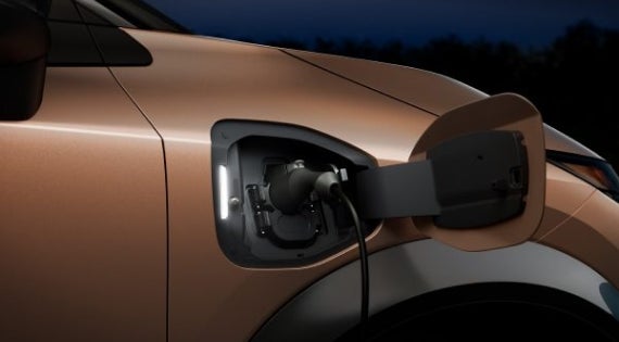Close-up image of charging cable plugged in | Redwood City Nissan in Redwood City CA